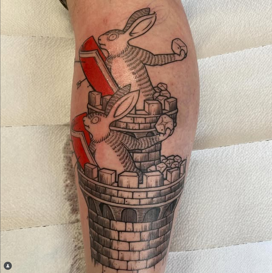 Rabbits defending a castle-tattoo